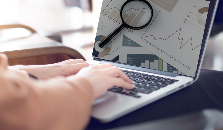Woman’s hands on her laptop performing a Core Web Vitals Audit