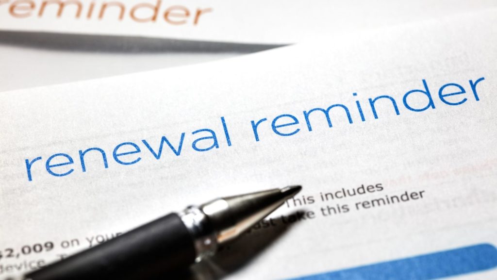 Pen with a renewal reminder printout 